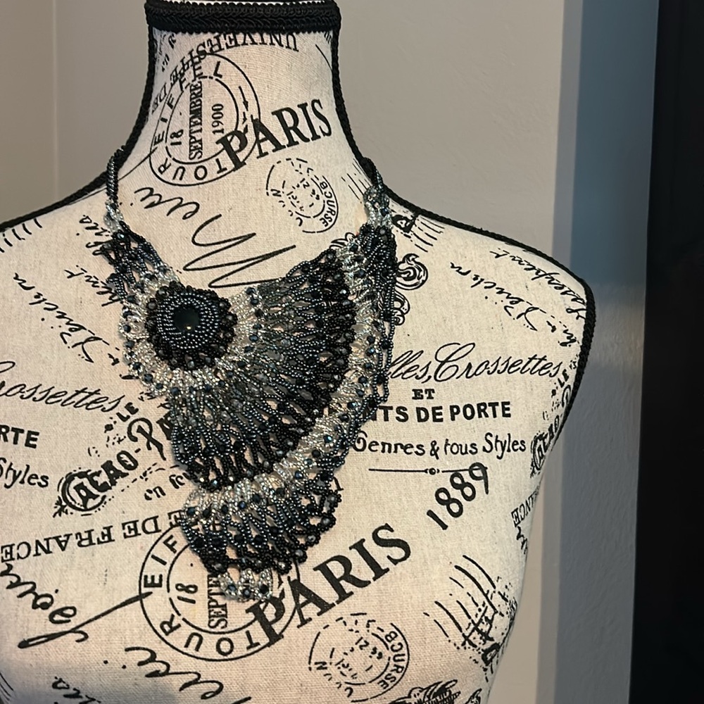 Intricate Silver and Black Owl Necklace with Textured Design